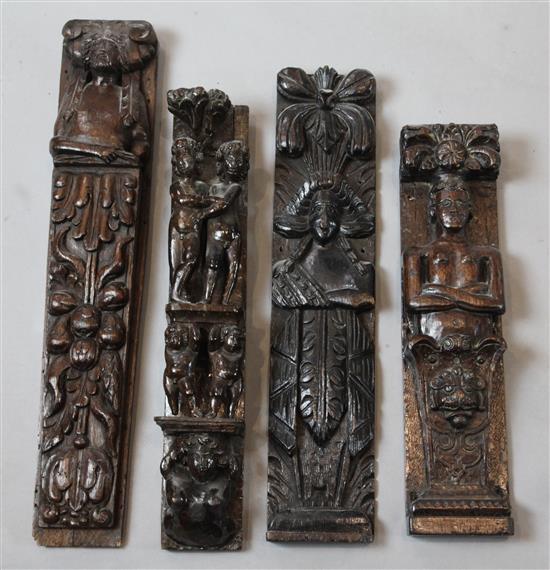Four 16th / 17th century carved oak corbels, largest 21in.